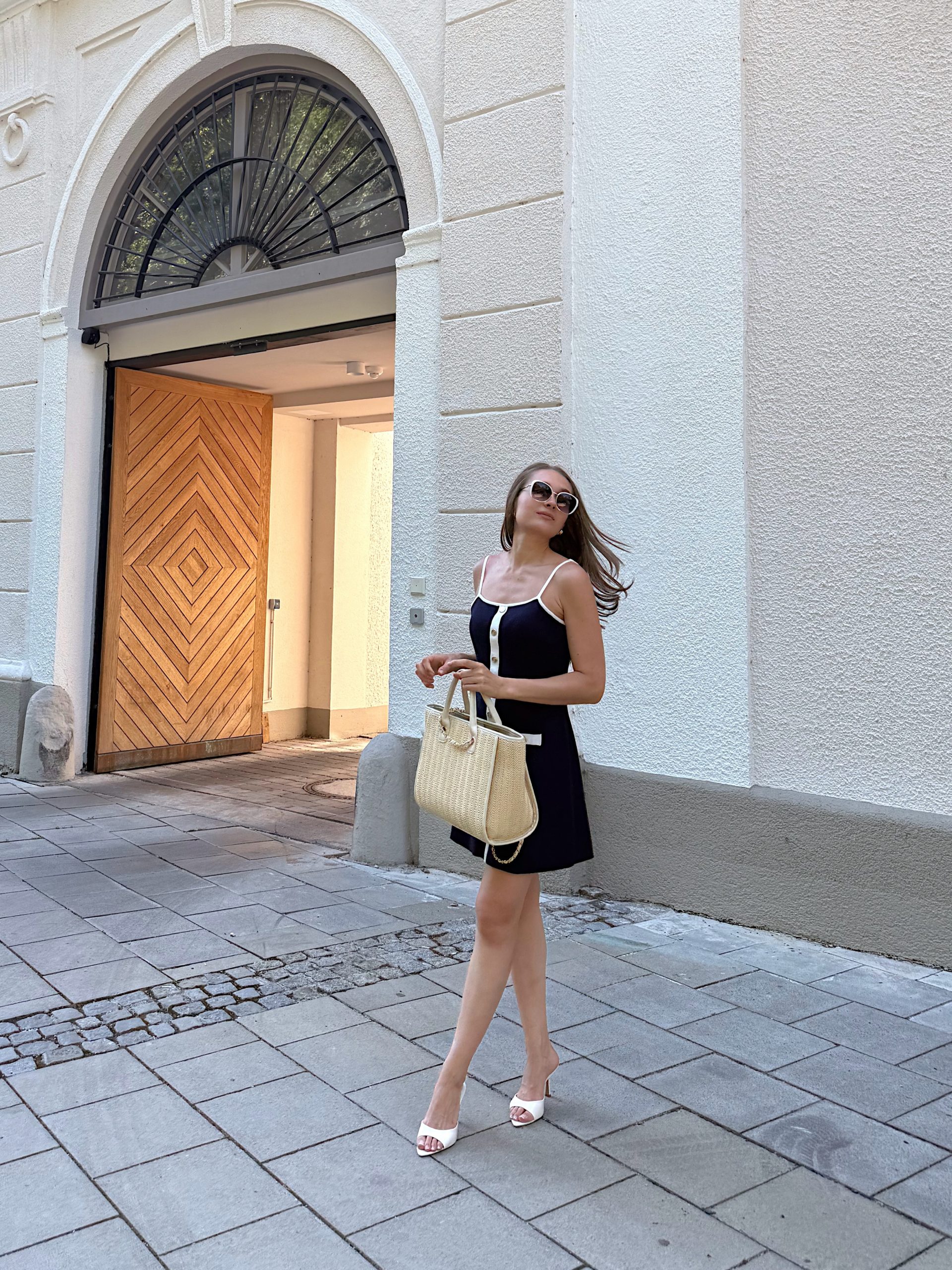 A Little Black Dress with White Trim That Makes Daytime Glamour Feel Easy